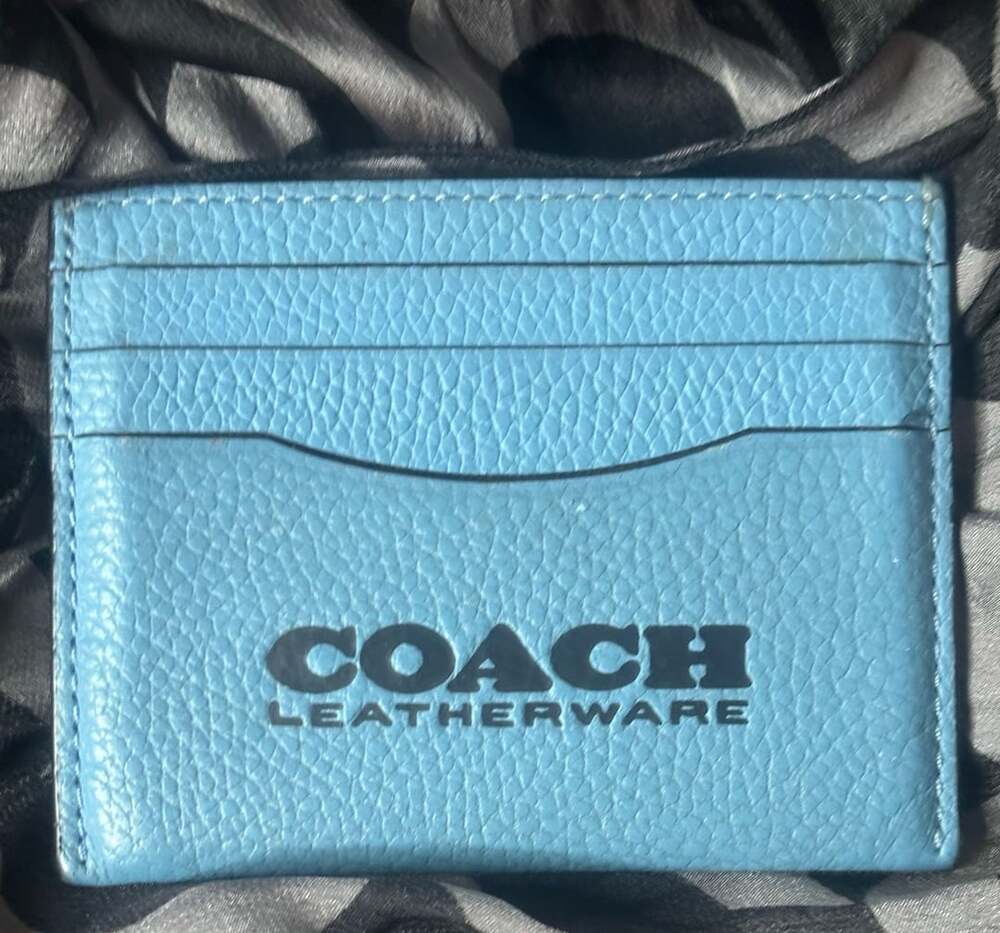 COACH Leatherware blue card wallet with center opening. Color block blue.
